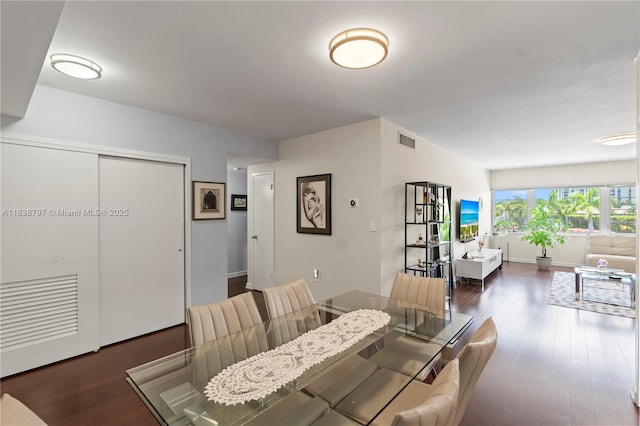 1700 NE 105th St Unit 312, Miami Shores, FL 33138 - dining space with wood finished floors and baseboards