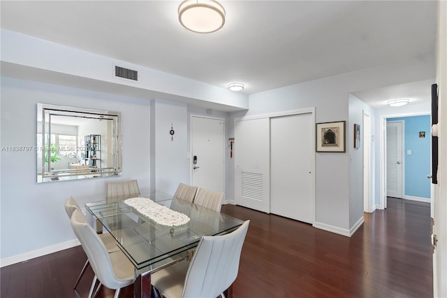 1700 NE 105th St Unit 312, Miami Shores, FL 33138 - dining space featuring baseboards and wood finished floors