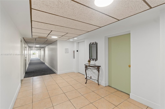 1700 NE 105th St Unit 312, Miami Shores, FL 33138 - hall featuring a drop ceiling and light tile patterned floors