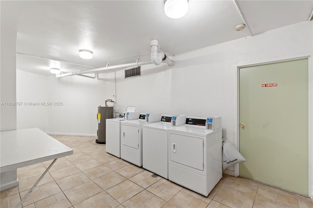 1700 NE 105th St Unit 312, Miami Shores, FL 33138 - community laundry featuring washing machine and clothes dryer and water heater