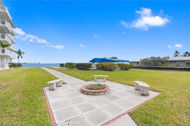 1700 NE 105th St Unit 312, Miami Shores, FL 33138 - view of patio with a water view
