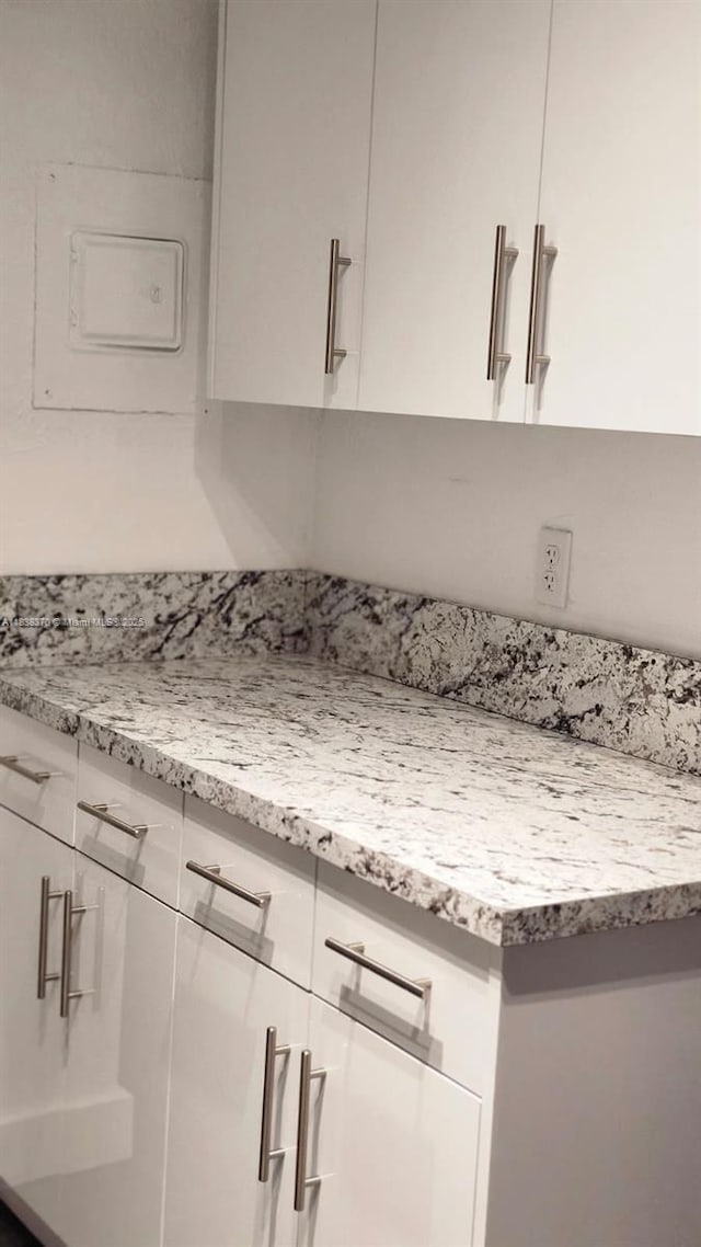 2501 NW 41st Ave Unit 201, Lauderhill, FL 33313 - detailed view of white cabinets and light stone countertops