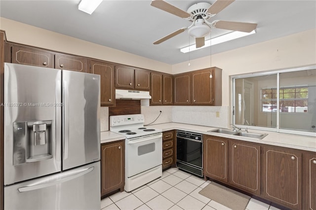 16805 SW 113th Ave Unit V41443, Miami, FL 33157 - kitchen with stainless steel fridge, white electric range, black dishwasher, and light countertops