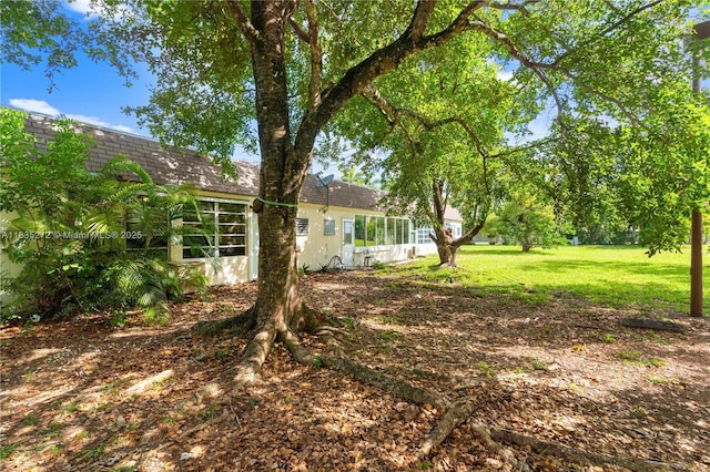 16805 SW 113th Ave Unit V41443, Miami, FL 33157 - view of grassy yard with a sunroom