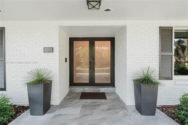8501 SW 72nd Ter, Miami, FL 33143 - view of exterior entry with french doors and brick siding