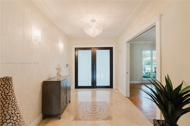 8501 SW 72nd Ter, Miami, FL 33143 - entryway featuring a chandelier, french doors, and ornamental molding