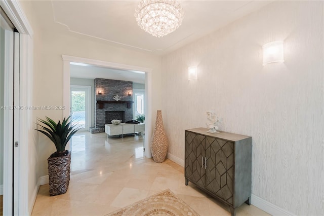 8501 SW 72nd Ter, Miami, FL 33143 - hallway featuring a chandelier and baseboards