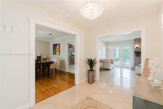 8501 SW 72nd Ter, Miami, FL 33143 - hallway with a chandelier and ornamental molding