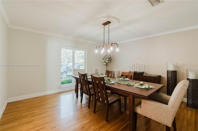 8501 SW 72nd Ter, Miami, FL 33143 - dining room with light wood finished floors and ornamental molding