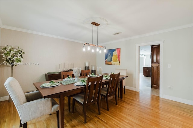 8501 SW 72nd Ter, Miami, FL 33143 - dining room with ornamental molding and light wood finished floors