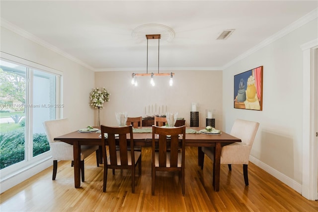 8501 SW 72nd Ter, Miami, FL 33143 - dining space featuring light wood-style flooring and crown molding
