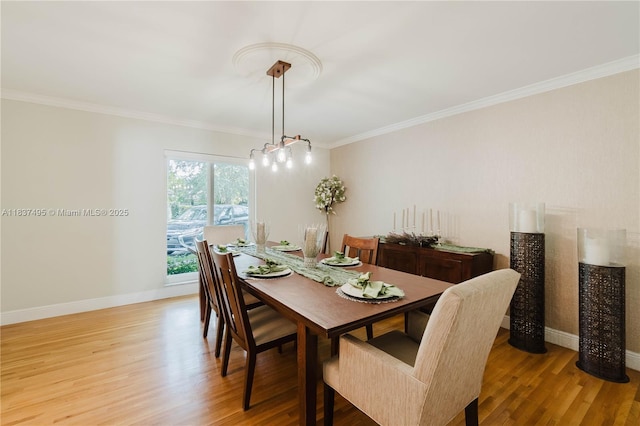 8501 SW 72nd Ter, Miami, FL 33143 - dining room featuring light wood-style floors and ornamental molding