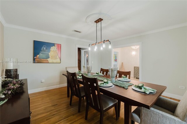 8501 SW 72nd Ter, Miami, FL 33143 - dining space featuring wood finished floors and crown molding