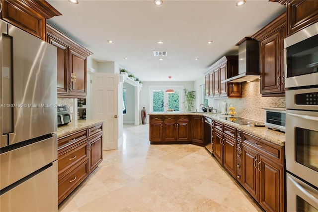 8501 SW 72nd Ter, Miami, FL 33143 - kitchen with appliances with stainless steel finishes, wall chimney exhaust hood, tasteful backsplash, recessed lighting, and a peninsula