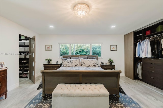 8501 SW 72nd Ter, Miami, FL 33143 - bedroom featuring light wood-type flooring, a chandelier, recessed lighting, and a closet