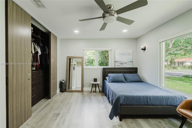 8501 SW 72nd Ter, Miami, FL 33143 - bedroom with light wood-type flooring, multiple windows, recessed lighting, and a ceiling fan