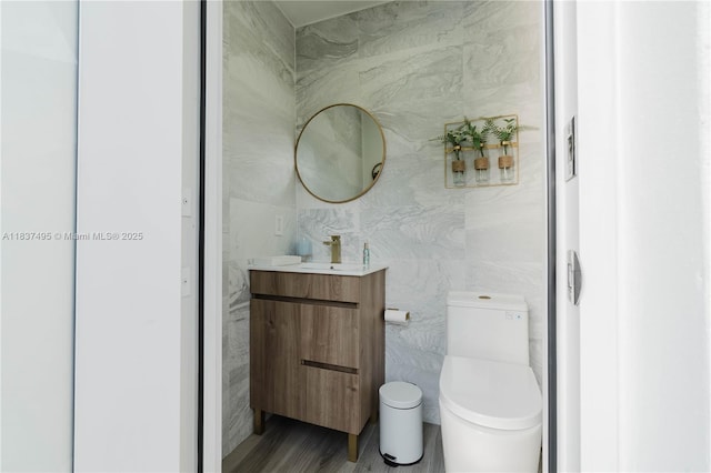 8501 SW 72nd Ter, Miami, FL 33143 - bathroom with tile walls, vanity, and wood finished floors