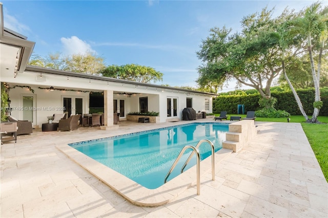 8501 SW 72nd Ter, Miami, FL 33143 - outdoor pool featuring french doors, a ceiling fan, an outdoor hangout area, and a patio