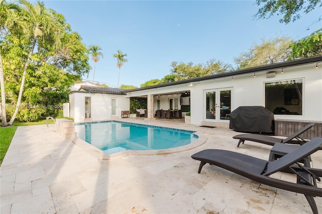 8501 SW 72nd Ter, Miami, FL 33143 - swimming pool with french doors, area for grilling, a patio area, and an outdoor structure