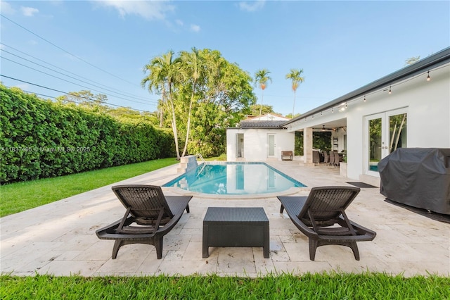 8501 SW 72nd Ter, Miami, FL 33143 - view of swimming pool with french doors, a grill, and a patio