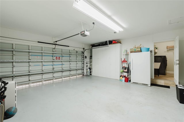 8501 SW 72nd Ter, Miami, FL 33143 - garage with a garage door opener and freestanding refrigerator