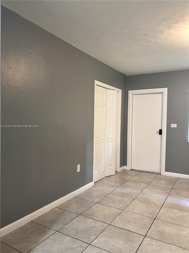 5010 NW 2nd Ave, Miami, FL 33127 - unfurnished bedroom with light tile patterned floors and a closet