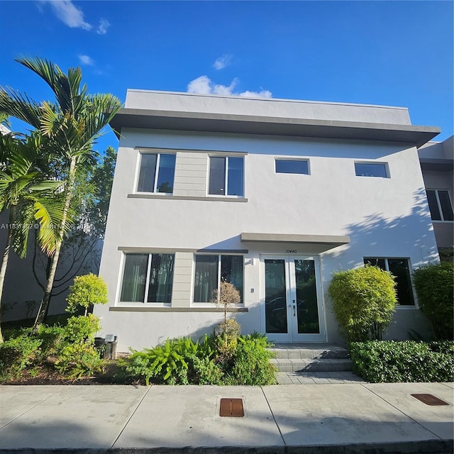 10440 NW 67th St Unit 10440, Doral, FL 33178 - view of front of property featuring french doors and stucco siding