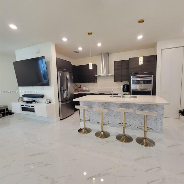 10440 NW 67th St Unit 10440, Doral, FL 33178 - kitchen with wall chimney range hood, appliances with stainless steel finishes, modern cabinets, a kitchen bar, and recessed lighting