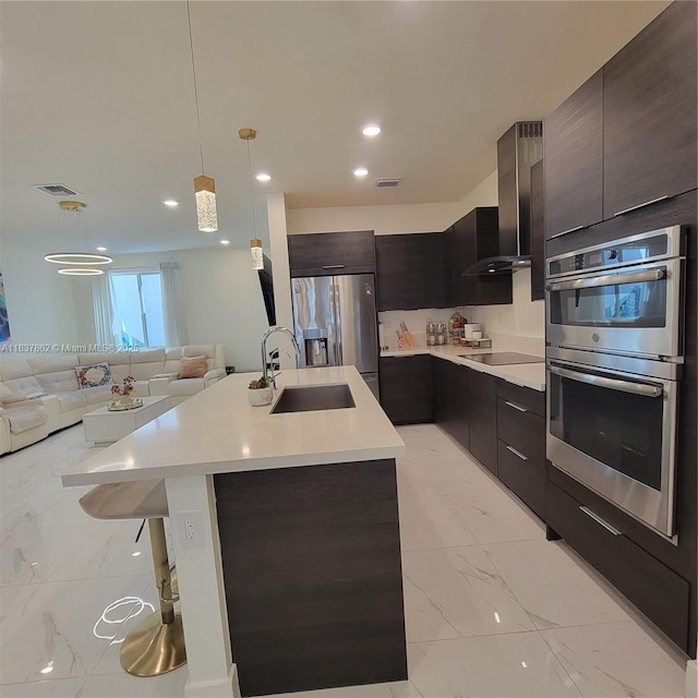 10440 NW 67th St Unit 10440, Doral, FL 33178 - kitchen with appliances with stainless steel finishes, modern cabinets, wall chimney range hood, light marble finish flooring, and open floor plan