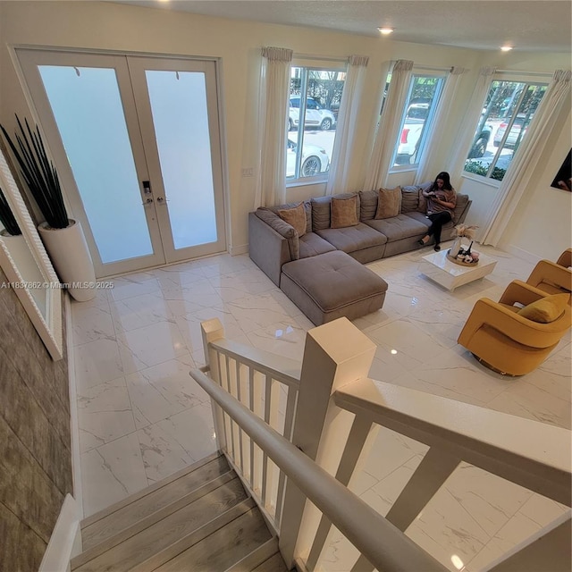 10440 NW 67th St Unit 10440, Doral, FL 33178 - living area featuring light marble finish flooring, french doors, and plenty of natural light