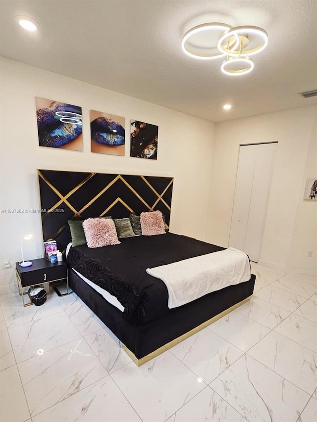10440 NW 67th St Unit 10440, Doral, FL 33178 - bedroom with marble look tile flooring and recessed lighting