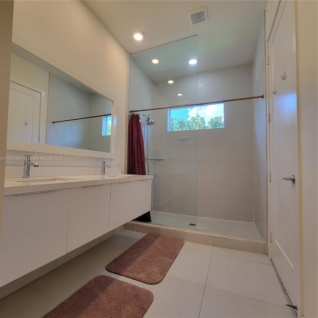 10440 NW 67th St Unit 10440, Doral, FL 33178 - bathroom featuring tiled shower, double vanity, tile patterned floors, and recessed lighting
