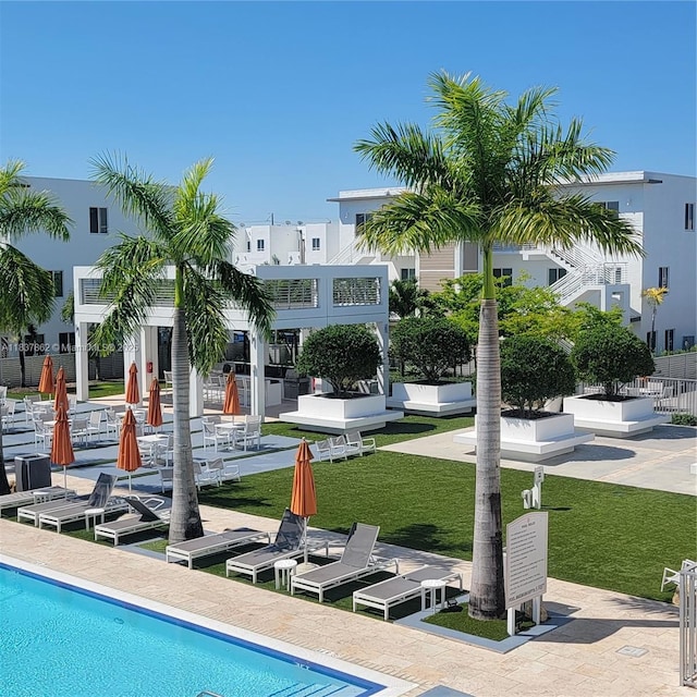 10440 NW 67th St Unit 10440, Doral, FL 33178 - community pool featuring a yard