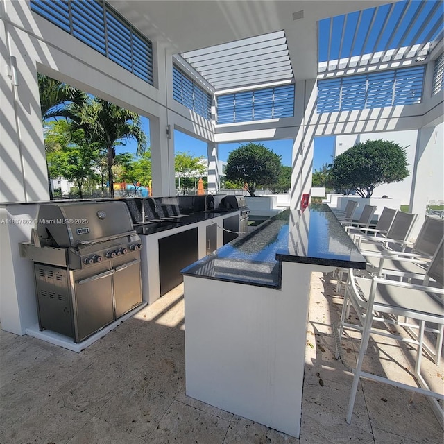 10440 NW 67th St Unit 10440, Doral, FL 33178 - view of patio / terrace featuring an outdoor kitchen and a pergola