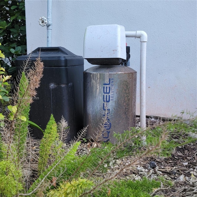 10440 NW 67th St Unit 10440, Doral, FL 33178 - exterior view of stucco siding and a water softener