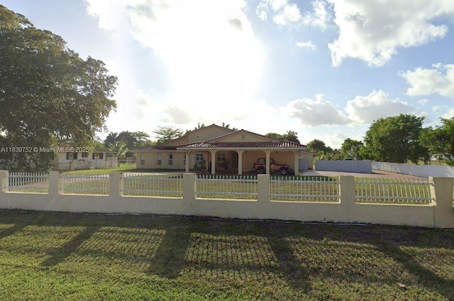 400 NW 128th Ave, Miami, FL 33182 - view of front of property with a fenced front yard, stucco siding, and a garage