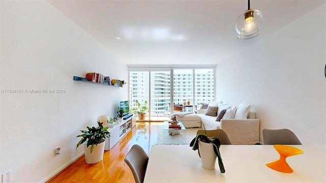 5600 Collins Ave Unit 10A, Miami Beach, FL 33140 - dining space featuring light wood finished floors and floor to ceiling windows