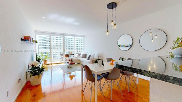 5600 Collins Ave Unit 10A, Miami Beach, FL 33140 - dining area featuring wood finished floors