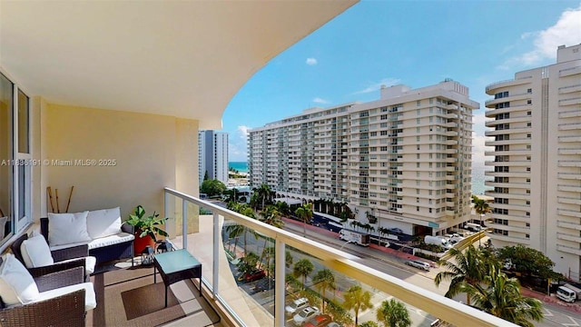 5600 Collins Ave Unit 10A, Miami Beach, FL 33140 - balcony featuring an outdoor hangout area and a city view