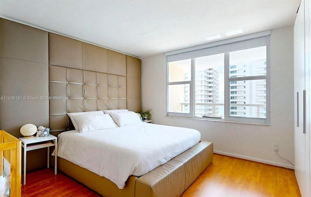 5600 Collins Ave Unit 10A, Miami Beach, FL 33140 - bedroom with wood finished floors