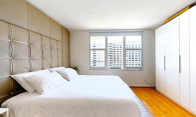 5600 Collins Ave Unit 10A, Miami Beach, FL 33140 - bedroom with light wood-style floors