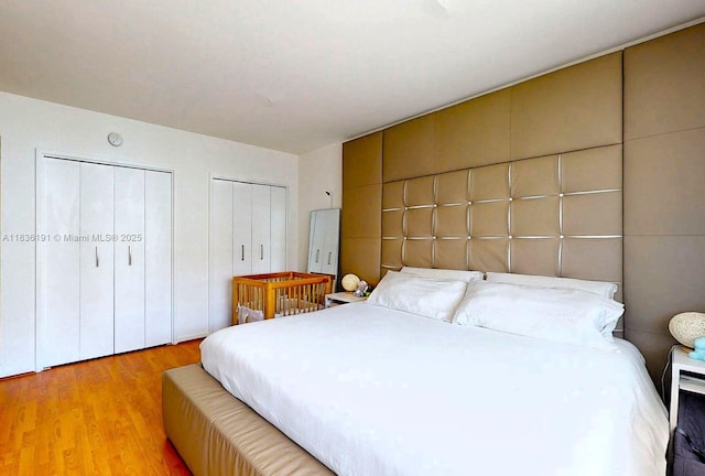 5600 Collins Ave Unit 10A, Miami Beach, FL 33140 - bedroom featuring multiple closets and light wood-style flooring