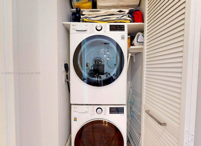 5600 Collins Ave Unit 10A, Miami Beach, FL 33140 - washroom with stacked washer and clothes dryer