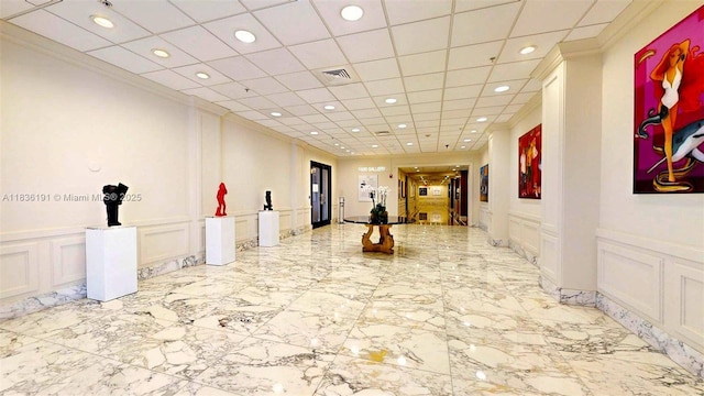 5600 Collins Ave Unit 10A, Miami Beach, FL 33140 - common area featuring a decorative wall, a wainscoted wall, recessed lighting, and a drop ceiling