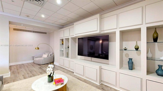 5600 Collins Ave Unit 10A, Miami Beach, FL 33140 - living area with built in features, light wood finished floors, crown molding, and recessed lighting