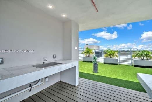 1850 Monroe Unit 301, Hollywood, FL 33020 - deck featuring a sink and a yard