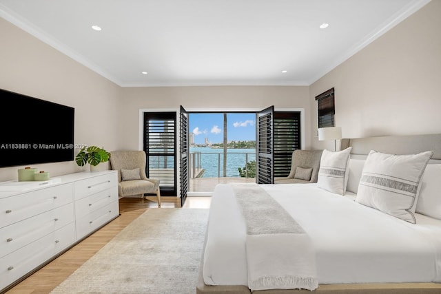 315 E Rivo Alto Dr, Miami Beach, FL 33139 - bedroom with light wood-style floors, ornamental molding, access to exterior, recessed lighting, and a water view