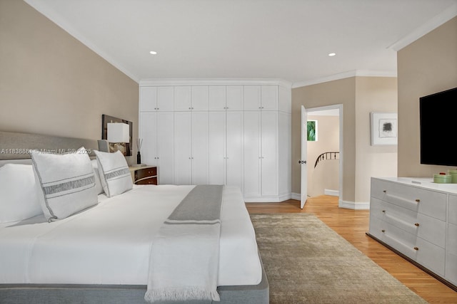 315 E Rivo Alto Dr, Miami Beach, FL 33139 - bedroom with crown molding, light wood-type flooring, and recessed lighting