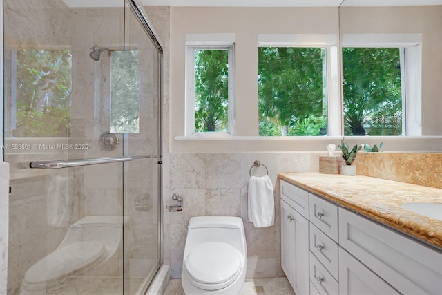 315 E Rivo Alto Dr, Miami Beach, FL 33139 - full bath with vanity, a shower stall, and tile walls