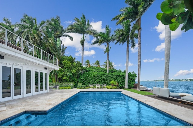 315 E Rivo Alto Dr, Miami Beach, FL 33139 - outdoor pool with french doors, a patio, and a water view